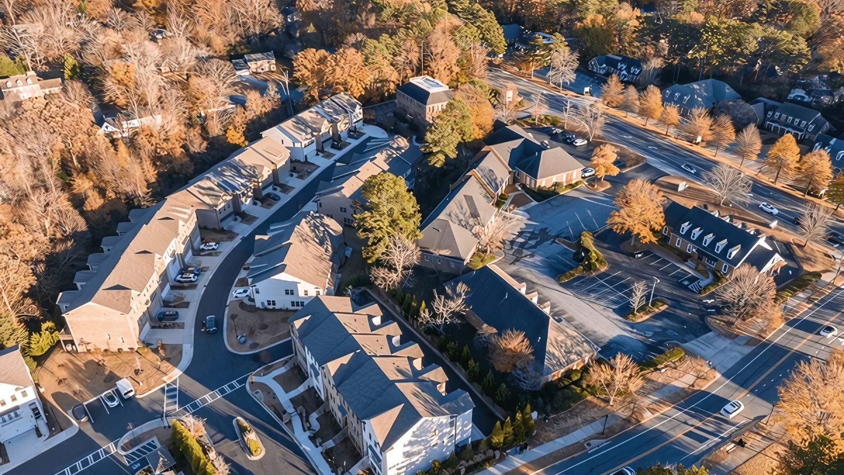 aerial view of a neighborhood with many houses and trees