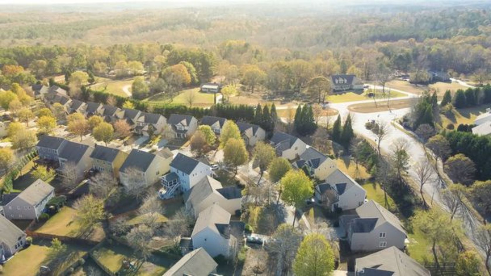 aerial view of a neighborhood with trees and houses