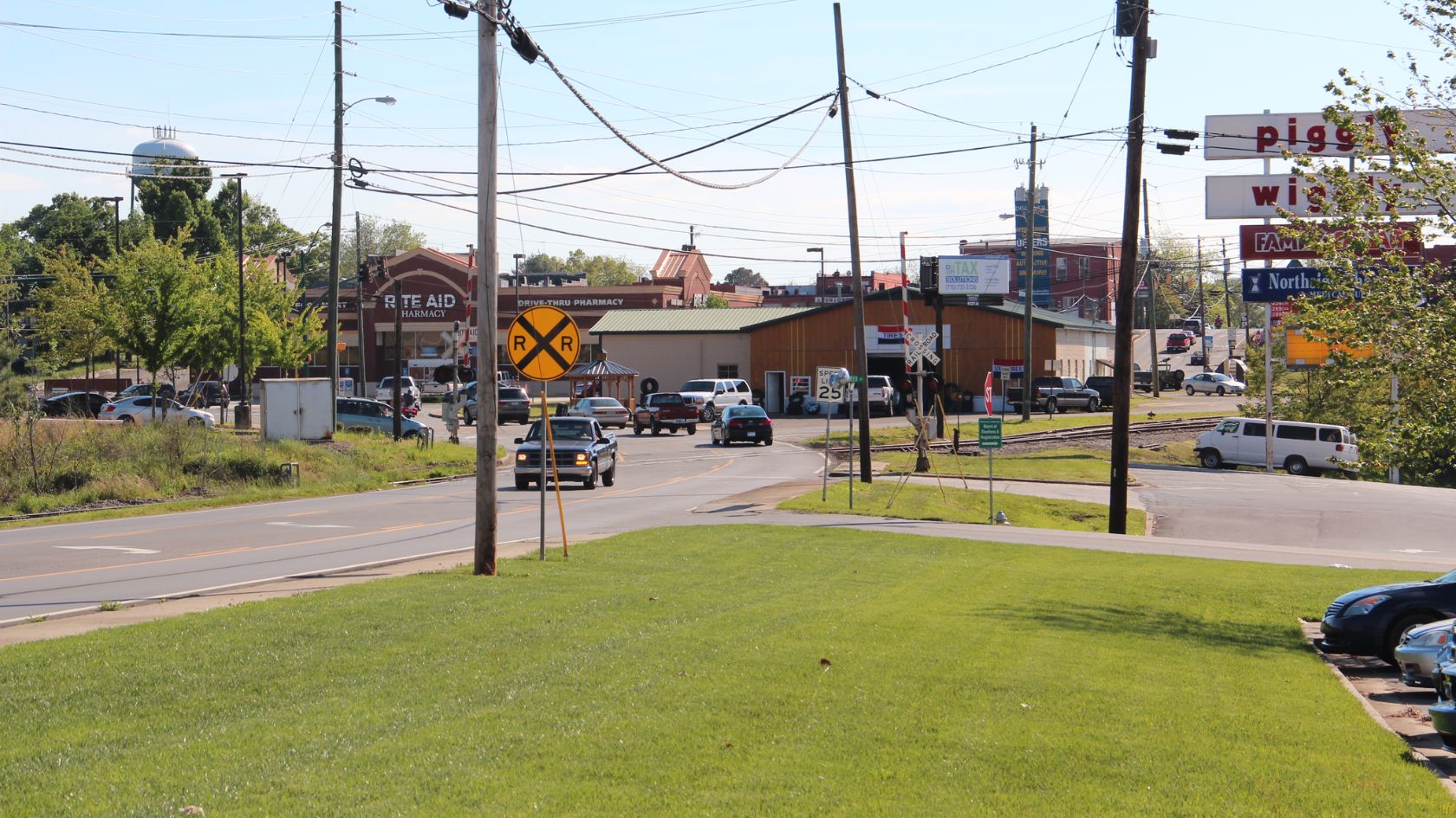 a road with cars and buildings